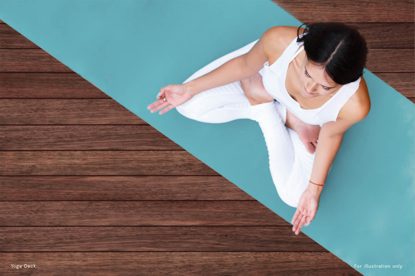Top view of beautiful young fitness woman working out on wooden floor terrace, doing yoga exercise, full length
